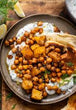 vegan Chickpea Marbella with Olives and Potato Bravas